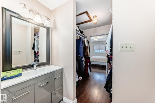 Contemporary vanity with a rectangular basin sink, chrome faucet, and spacious storage drawers - 9110 180A Avenue, Edmonton, AB - Indoor