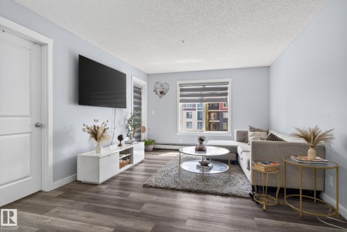 318 5810 Mullen Place, Edmonton, AB - Indoor Photo Showing Living Room