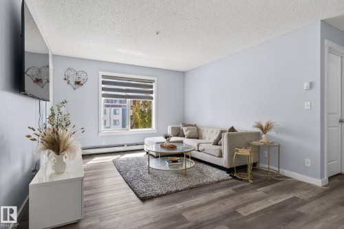 318 5810 Mullen Place, Edmonton, AB - Indoor Photo Showing Living Room