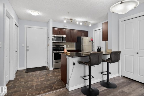 318 5810 Mullen Place, Edmonton, AB - Indoor Photo Showing Kitchen With Stainless Steel Kitchen