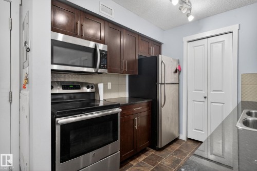 318 5810 Mullen Place, Edmonton, AB - Indoor Photo Showing Kitchen With Double Sink