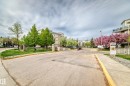 Paved entry drive leading to apartment buildings with multiple balconies - 331 9704 174 Street, Edmonton, AB  - Outdoor 