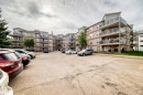 Multi-story building featuring tan siding and multiple balconies with glass railings - 331 9704 174 Street, Edmonton, AB  - Outdoor 