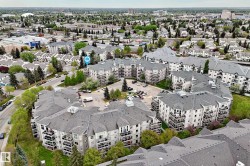 Multi-level residential buildings featuring private balconies and gabled roofs - 
