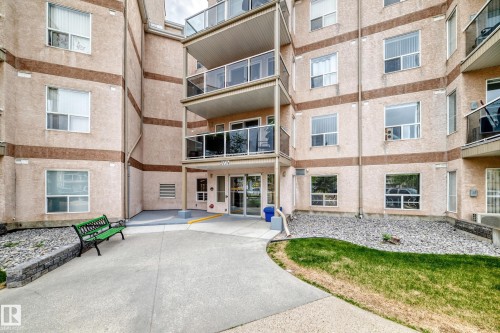 Multi-story building featuring a stucco exterior with decorative banding - 331 9704 174 Street, Edmonton, AB - Outdoor