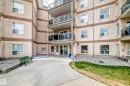Multi-story building featuring a stucco exterior with decorative banding - 331 9704 174 Street, Edmonton, AB  - Outdoor 