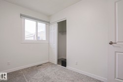 Neutral wall color with white trim and grey patterned carpet - 