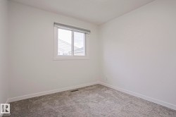 Neutral tone wall finish and white trim - 