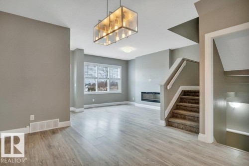 2036 South Creek Drive, Stony Plain, AB - Indoor Photo Showing Other Room With Fireplace