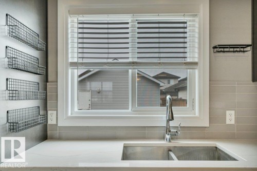 2036 South Creek Drive, Stony Plain, AB - Indoor Photo Showing Kitchen With Double Sink
