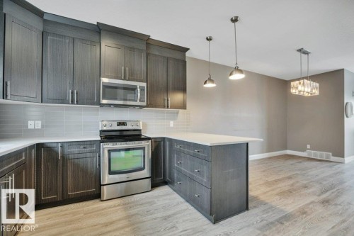 2036 South Creek Drive, Stony Plain, AB - Indoor Photo Showing Kitchen With Stainless Steel Kitchen With Upgraded Kitchen