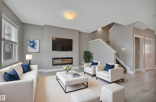 2036 South Creek Drive, Stony Plain, AB - Indoor Photo Showing Living Room With Fireplace