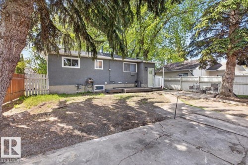 Exterior featuring gray siding, white trim windows, and a rear deck - 4630 114 Avenue, Edmonton, AB - Outdoor