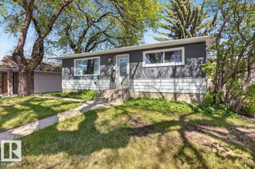 Contemporary exterior with gray stucco and white siding - 4630 114 Avenue, Edmonton, AB - Outdoor