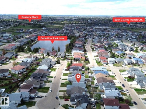 Aerial perspective showcasing a residential neighborhood with a prominent lake - 8604 157 Avenue, Edmonton, AB - Outdoor With View