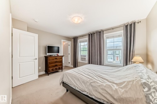 Neutral-toned carpeting throughout - 2125 24 Street, Edmonton, AB - Indoor Photo Showing Bedroom