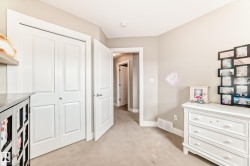 Neutral-toned room with light-colored carpet flooring - 