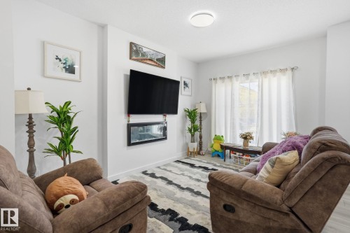 65 Covell Common, Spruce Grove, AB - Indoor Photo Showing Living Room With Fireplace