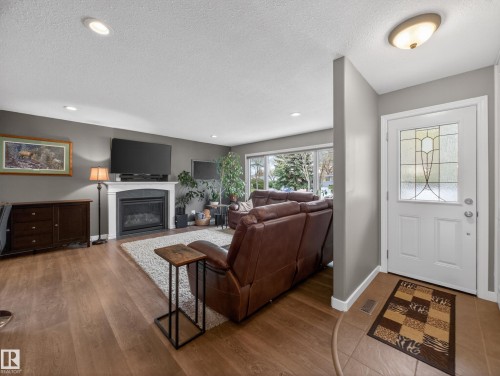 8410 95B Ave, Fort Saskatchewan, AB - Indoor Photo Showing Other Room With Fireplace