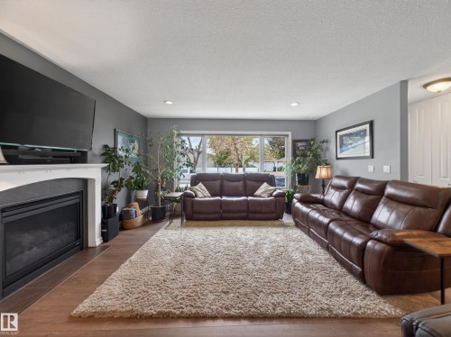 8410 95B Ave, Fort Saskatchewan, AB - Indoor Photo Showing Living Room With Fireplace