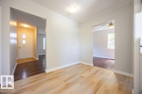 Interior space featuring light wood-finish flooring and neutral wall tones - 8714 164 Street, Edmonton, AB 