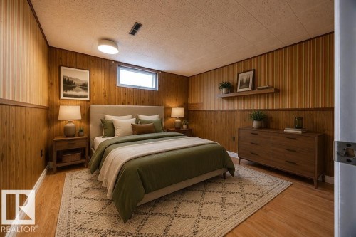 Wood-paneled room featuring wood-finish flooring, a window, and a flush-mount ceiling light. Virtually Staged Photo. - 8714 164 Street, Edmonton, AB 