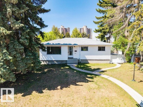 Single-story residence featuring white siding and a light-colored shingle roof - 8714 164 Street, Edmonton, AB 