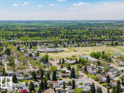 Expansive aerial perspective showcasing a residential area with numerous mature trees - 8714 164 Street, Edmonton, AB 