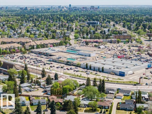 Aerial perspective featuring a commercial center surrounded by residential areas and extensive green space - 8714 164 Street, Edmonton, AB 