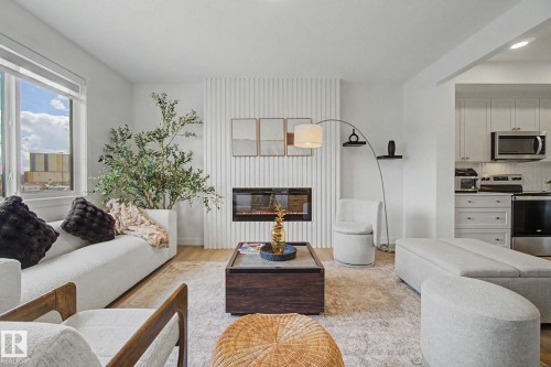 117 Brickyard Drive, Stony Plain, AB - Indoor Photo Showing Living Room With Fireplace