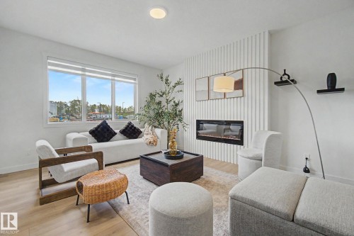 117 Brickyard Drive, Stony Plain, AB - Indoor Photo Showing Living Room With Fireplace