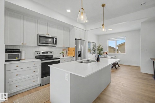 117 Brickyard Drive, Stony Plain, AB - Indoor Photo Showing Kitchen With Stainless Steel Kitchen With Double Sink With Upgraded Kitchen