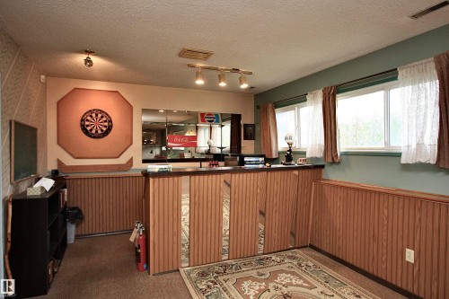 Yes, the dartboard is included! Friday nights just got fun! - 13315 136 Street, Edmonton, AB - Indoor Photo Showing Other Room