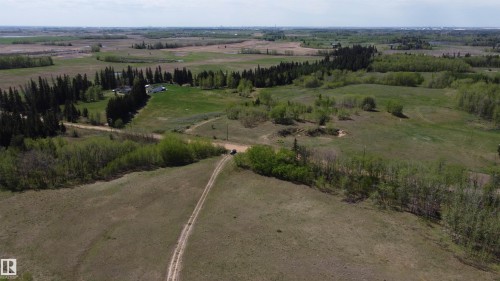 Front entry open space ideal location to set up Shop or Business with easy access to range road while keeping your new residence just over the ridge private, work and live on your own land. - 563003 Range Road 205, Rural Lamont County, AB 