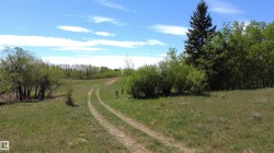 The natural rise and fall of the land creates a picturesque setting for this property. - 