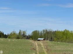 Bring your building plans to this rolling land ideal for a hillside residence. - 