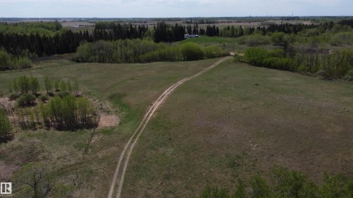 Bring your horses, cattle, any livestock—the expansive pasture lands provide the perfect space to raise your own animals right at home. - 563003 Range Road 205, Rural Lamont County, AB 