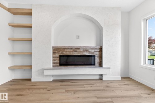 5310 103A Avenue, Edmonton, AB - Indoor Photo Showing Other Room With Fireplace
