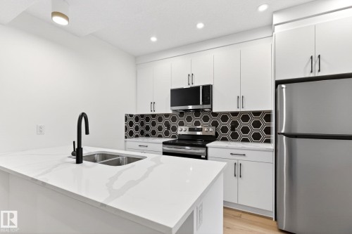 5310 103A Avenue, Edmonton, AB - Indoor Photo Showing Kitchen With Double Sink With Upgraded Kitchen