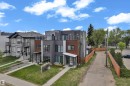 Modern multi-story dwelling featuring a flat roofline and a balcony with glass railings - 9329 Connors Road, Edmonton, AB  - Outdoor 
