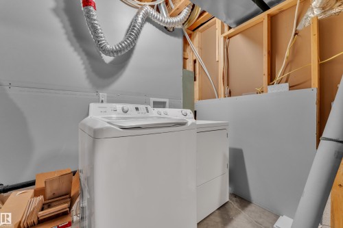 Dedicated laundry area featuring a white top-load washing machine and a white dryer - 432 Watt Boulevard, Edmonton, AB - Indoor Photo Showing Laundry Room