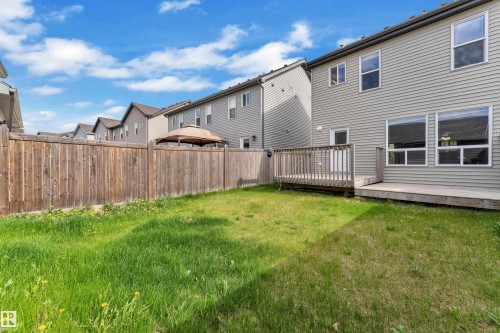 Expansive rear yard featuring a wooden privacy fence and a multi-level wood deck - 432 Watt Boulevard, Edmonton, AB - Outdoor