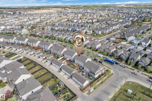 Aerial perspective showcasing a residential neighborhood with detached homes, featuring varied architectural styles and rooflines - 432 Watt Boulevard, Edmonton, AB -  With View
