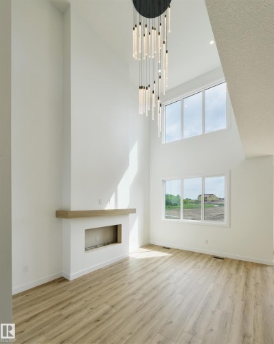 1305 Hawks Ridge Link Nw, Edmonton, AB - Indoor Photo Showing Other Room With Fireplace