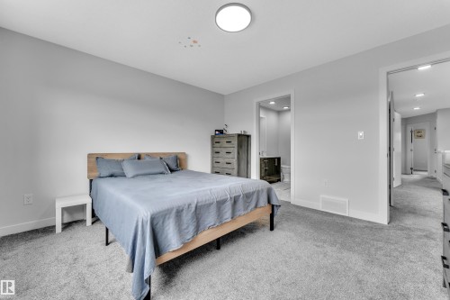 Carpeted room with light grey walls and a flush-mount ceiling light - 1118 Goldfinch Crescent, Edmonton, AB - Indoor Photo Showing Bedroom
