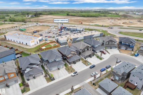 Modern residential development featuring a variety of single-family homes with attached garages - 1118 Goldfinch Crescent, Edmonton, AB - Outdoor With View