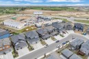 Modern residential development featuring a variety of single-family homes with attached garages - 1118 Goldfinch Crescent, Edmonton, AB  - Outdoor With View 