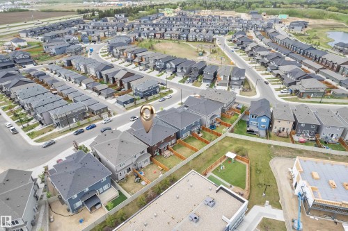 Aerial perspective of a developed residential area featuring various modern detached houses with dark roofs - 1118 Goldfinch Crescent, Edmonton, AB -  With View