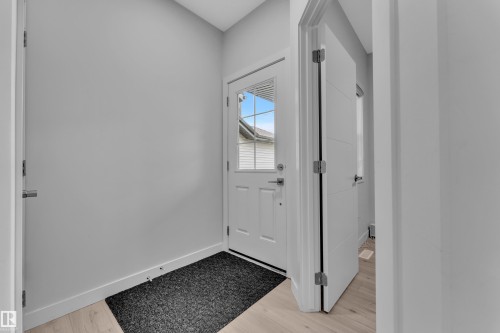 Entryway with light wood-finish flooring and neutral wall tones - 1118 Goldfinch Crescent, Edmonton, AB - Indoor Photo Showing Other Room