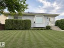 Light blue siding exterior featuring a bay window and dark shingle roofing - 4005 55 Avenue, Whitecourt, AB  - Outdoor 